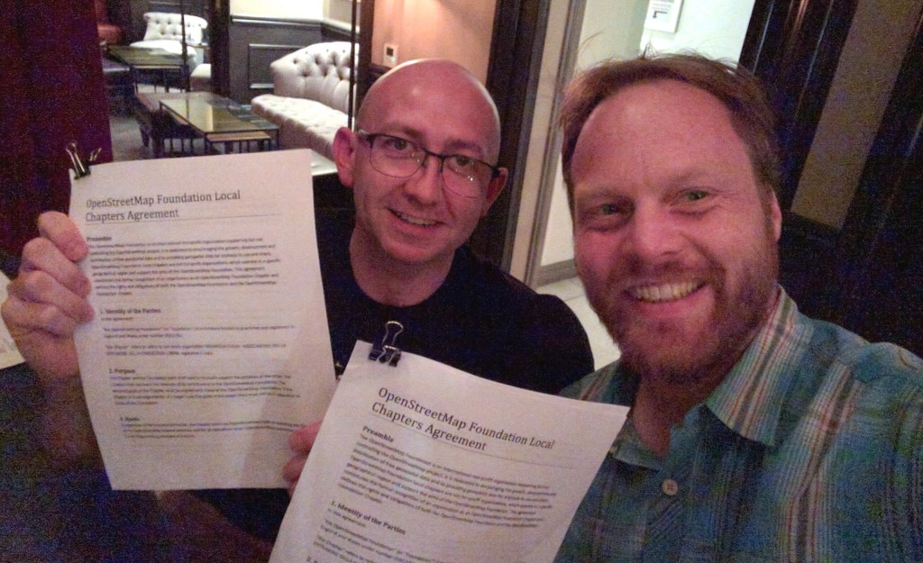Simone Cortesi of OpenStreetMap Italia (left) and Martijn van Exel OSMF board (right), signing the local chapter agreement